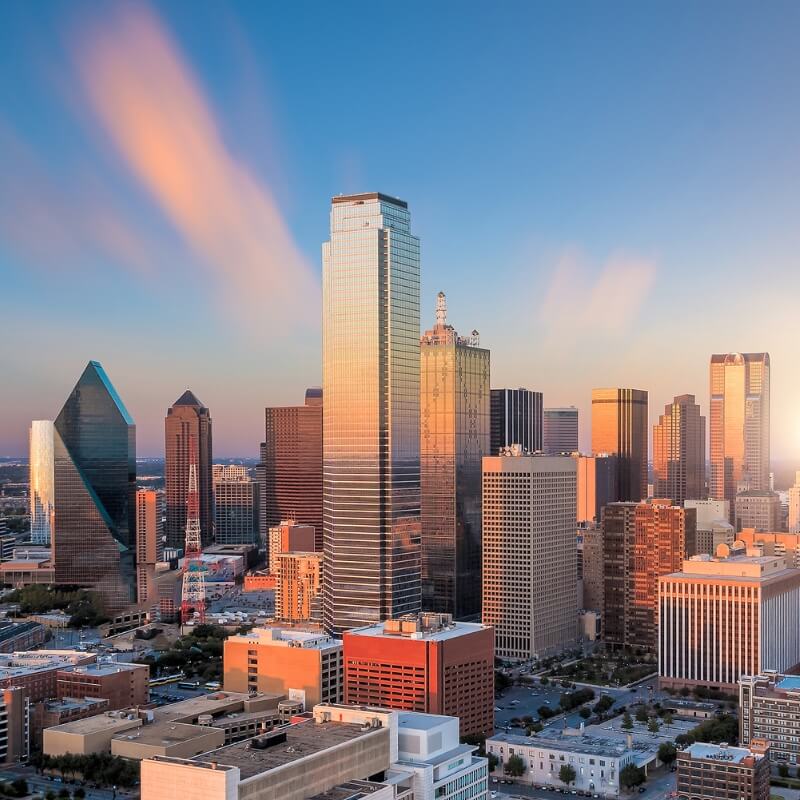 property management company in Arlington tx skyline of dallas fort worth metroplex at dusk